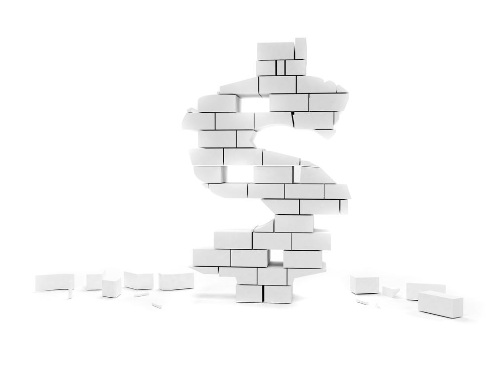 Dollar symbol built on bricks collapsing isolated over white