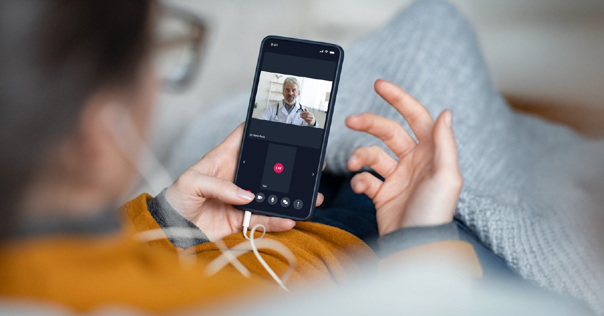 Patient on a video call with a physician using a telehealth app on a smartphone